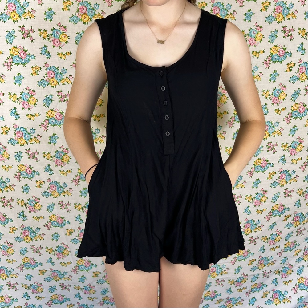 RVCA black sleeveless mini romper with button front.
